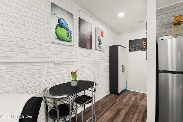 kitchen with recessed lighting, ornamental molding, dark wood-style flooring, and freestanding refrigerator