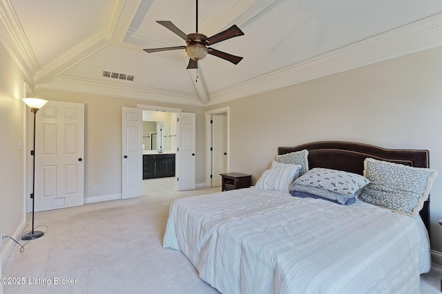 bedroom featuring connected bathroom, light colored carpet, visible vents, baseboards, and crown molding