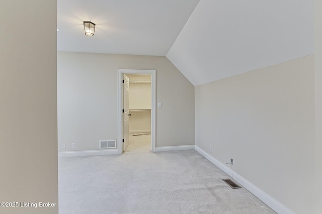 bonus room featuring carpet, visible vents, vaulted ceiling, and baseboards