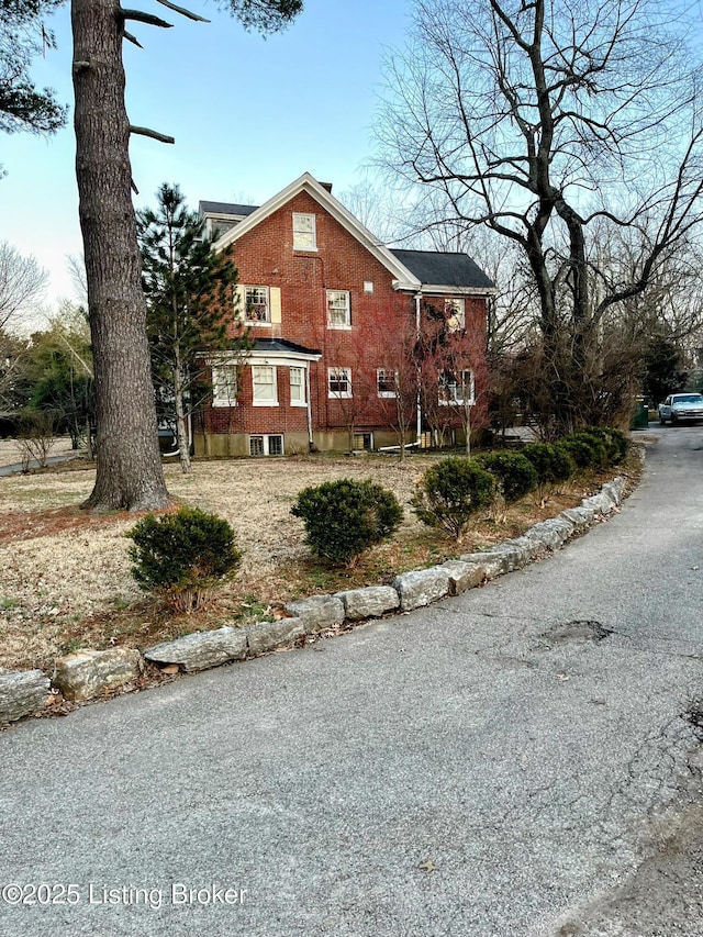 view of home's exterior with brick siding