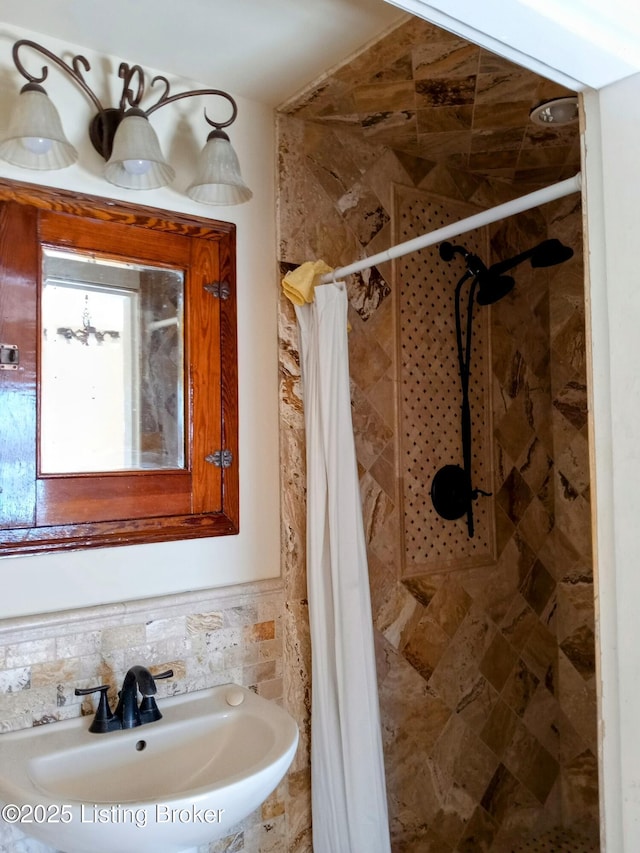 full bathroom with a sink and a shower stall