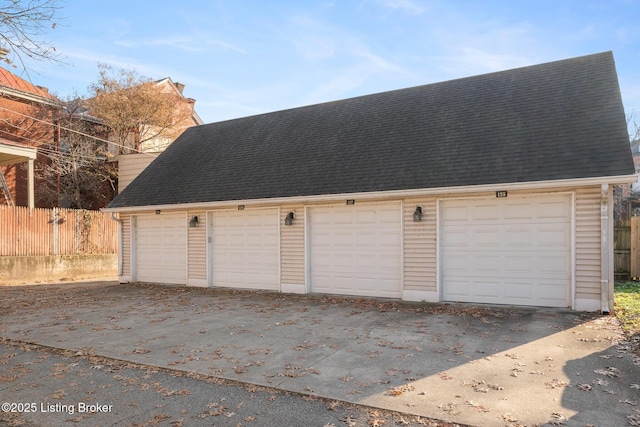 garage with fence