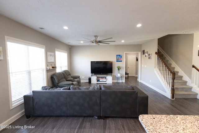 living room with baseboards, stairway, dark wood-style flooring, and recessed lighting