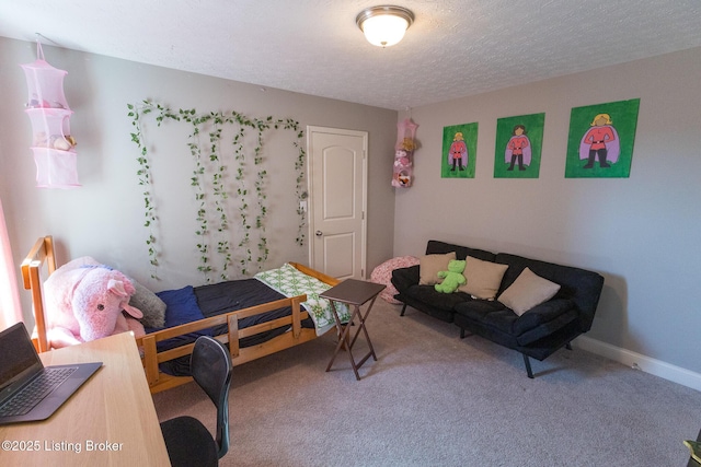 bedroom featuring a textured ceiling, baseboards, and carpet flooring