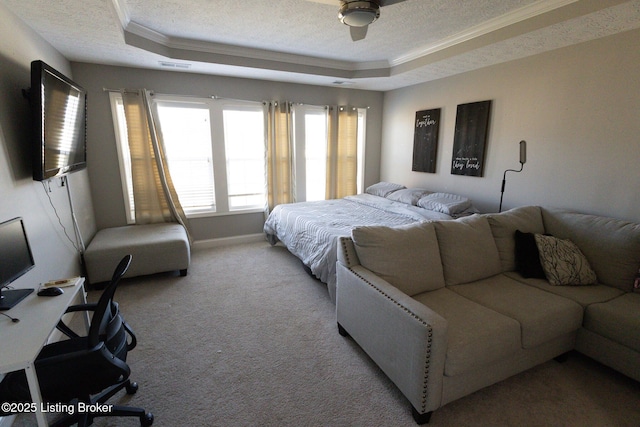 bedroom with a tray ceiling, visible vents, light carpet, and a textured ceiling