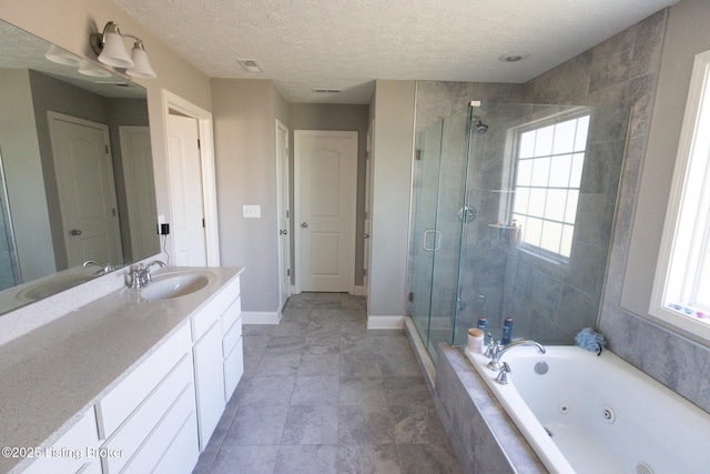 bathroom featuring vanity, visible vents, baseboards, a jetted tub, and a shower stall