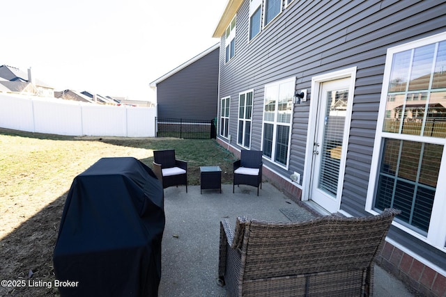 view of patio / terrace featuring a fenced backyard and a grill