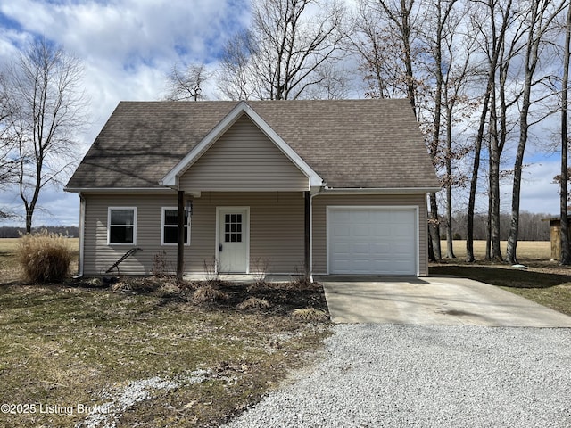 view of front of house with a garage, driveway, and roof with shingles