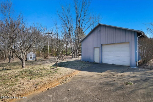 detached garage with aphalt driveway