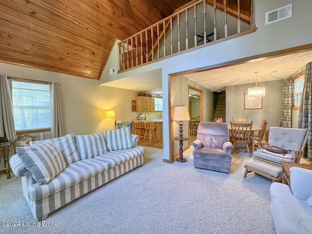 carpeted living room with visible vents, high vaulted ceiling, a chandelier, and wood ceiling