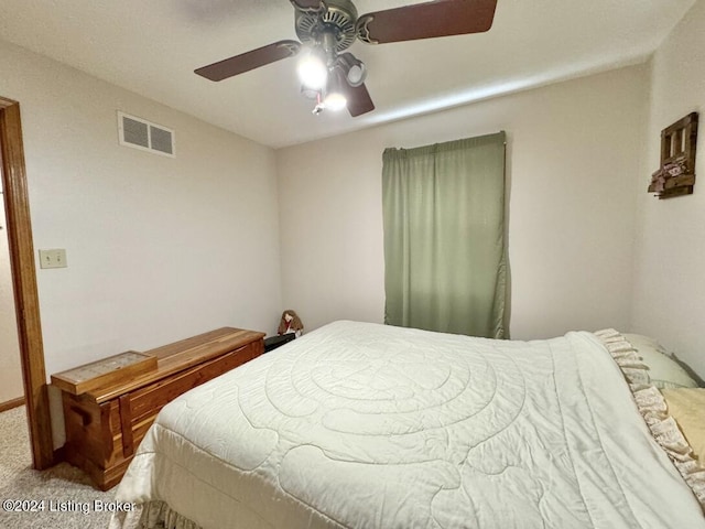 bedroom with a ceiling fan, visible vents, and carpet flooring