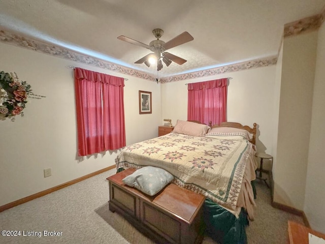 bedroom with carpet floors, baseboards, and a ceiling fan