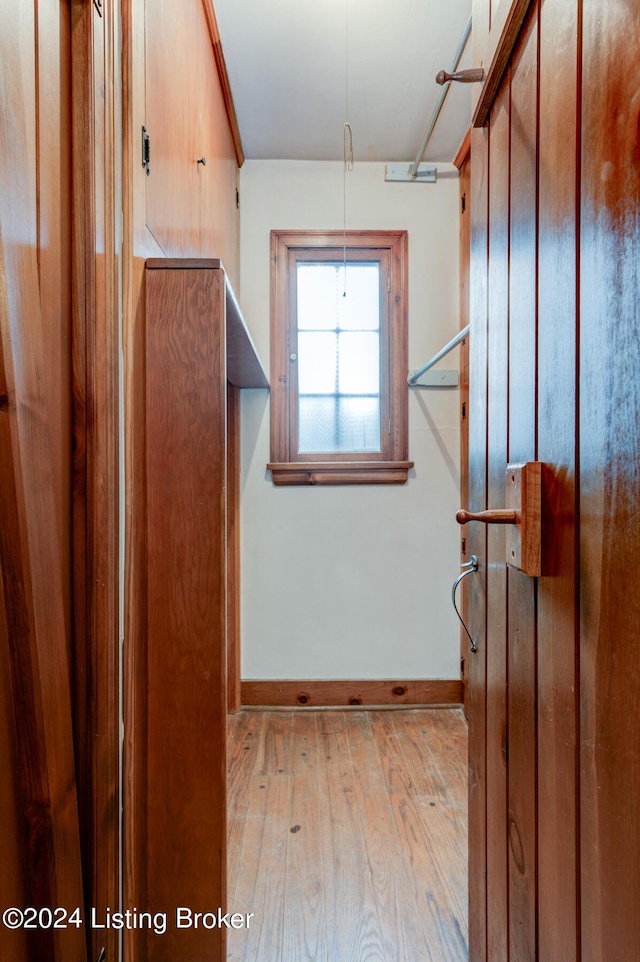 interior space featuring hardwood / wood-style flooring and baseboards