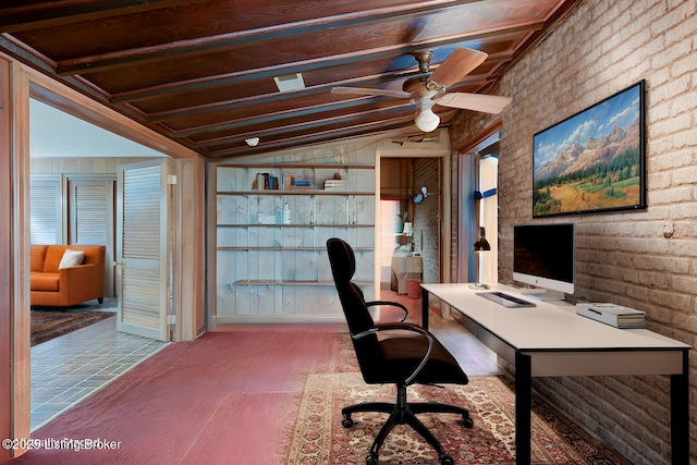 office featuring brick floor, a ceiling fan, brick wall, and vaulted ceiling with beams