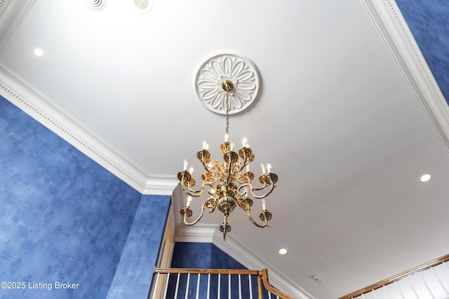 interior details featuring a chandelier and crown molding