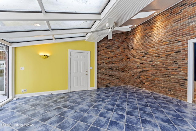 interior space with lofted ceiling with beams and ceiling fan