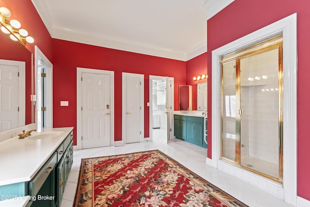 bathroom featuring tile patterned floors, ornamental molding, a shower stall, baseboards, and vanity