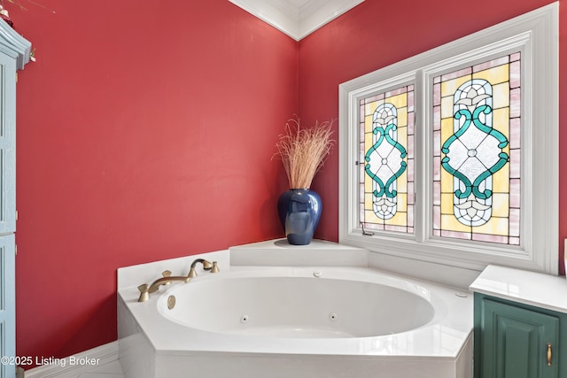 full bath featuring ornamental molding and a whirlpool tub