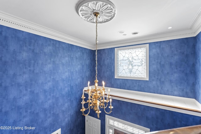 room details featuring visible vents, a notable chandelier, and ornamental molding