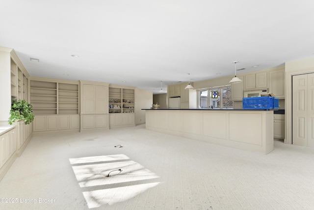 unfurnished living room featuring light carpet, recessed lighting, and built in shelves