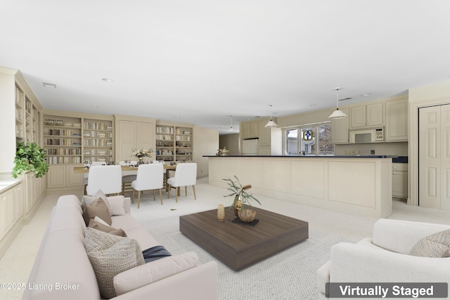 living area with recessed lighting and light colored carpet