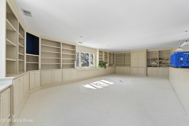 unfurnished room featuring light colored carpet and visible vents