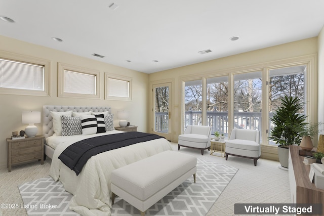 bedroom featuring light carpet, visible vents, and recessed lighting