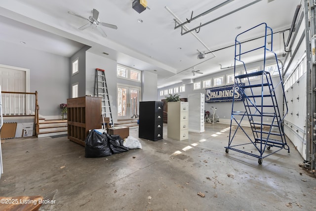 garage with french doors and a ceiling fan