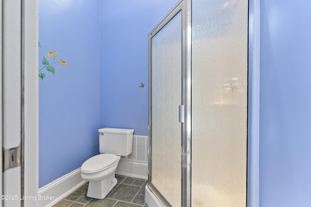 full bathroom with visible vents, baseboards, a stall shower, tile patterned flooring, and toilet