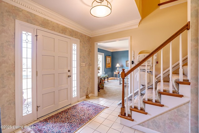 entryway featuring baseboards, tile patterned flooring, stairs, and crown molding