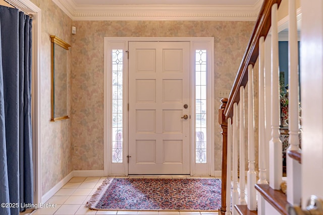 foyer featuring crown molding, light tile patterned floors, wallpapered walls, baseboards, and stairs