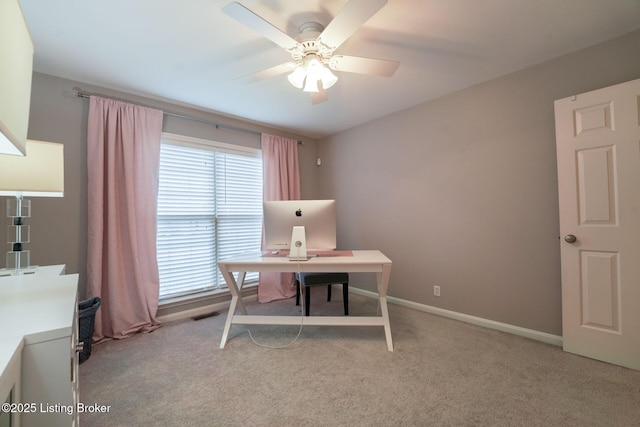 home office featuring visible vents, baseboards, a ceiling fan, and carpet flooring