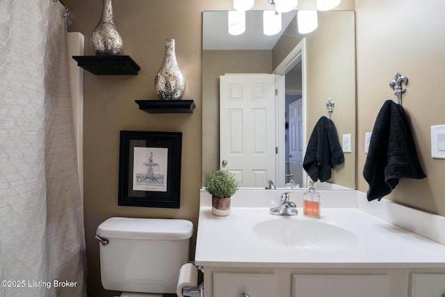 bathroom with vanity and toilet