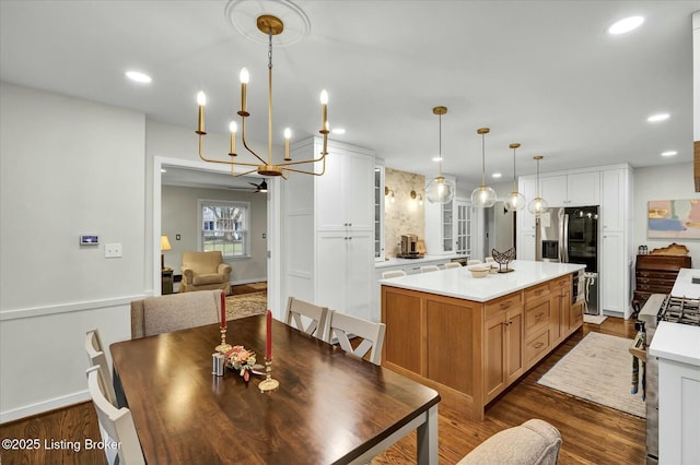 dining space with ceiling fan, baseboards, dark wood-style flooring, and recessed lighting