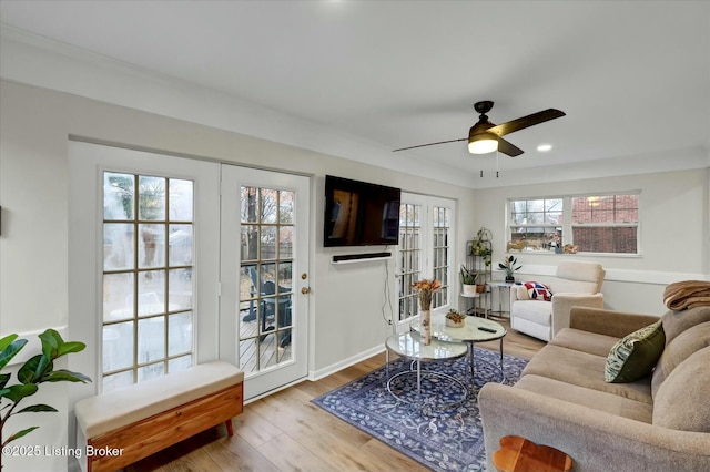 living room featuring ceiling fan, recessed lighting, wood finished floors, and baseboards