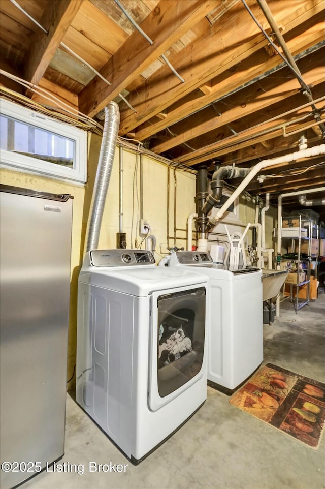 clothes washing area featuring laundry area and separate washer and dryer