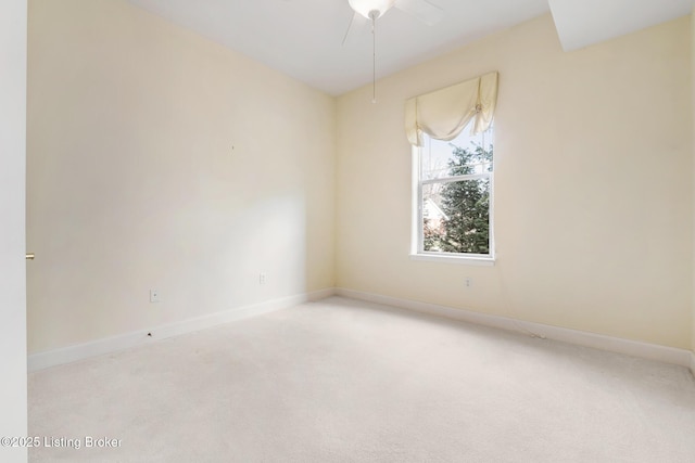 carpeted empty room with baseboards