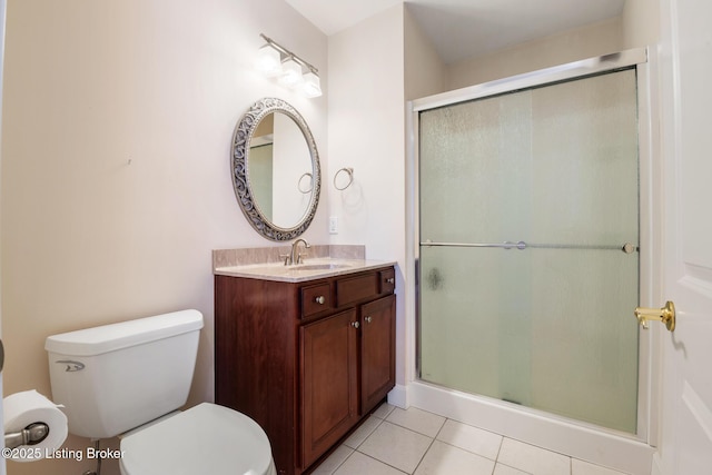 bathroom featuring vanity, tile patterned flooring, a shower stall, and toilet