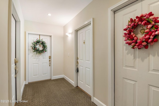 doorway with recessed lighting, carpet, and baseboards