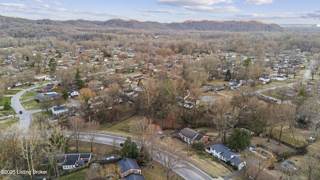 drone / aerial view with a mountain view and a wooded view