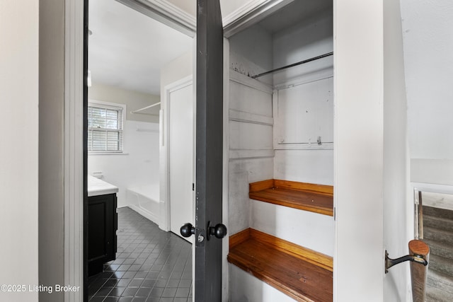 bathroom featuring tile patterned flooring and vanity