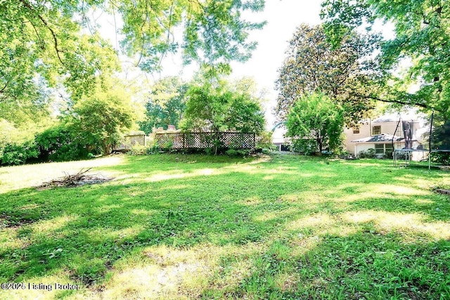 view of yard featuring a trampoline