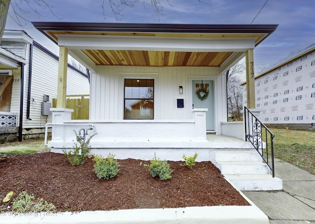 view of front of house with covered porch and board and batten siding