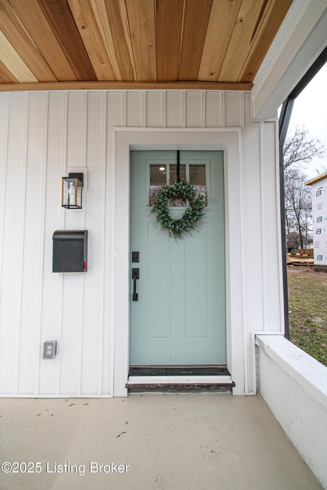 entrance to property featuring board and batten siding