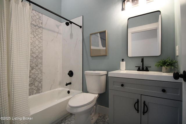 bathroom with marble finish floor, toilet, shower / bath combo with shower curtain, vanity, and baseboards