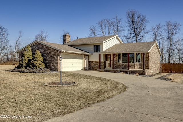 view of front of property featuring driveway, brick siding, a chimney, and fence