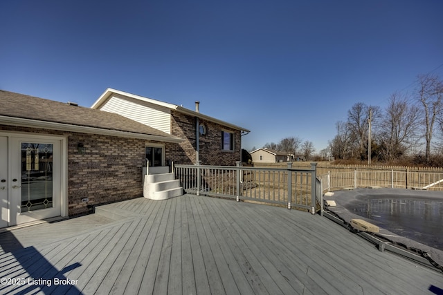 wooden deck featuring fence