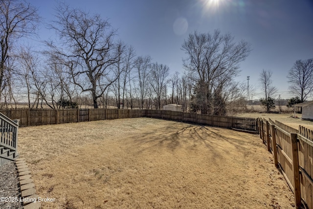 view of yard with a fenced backyard