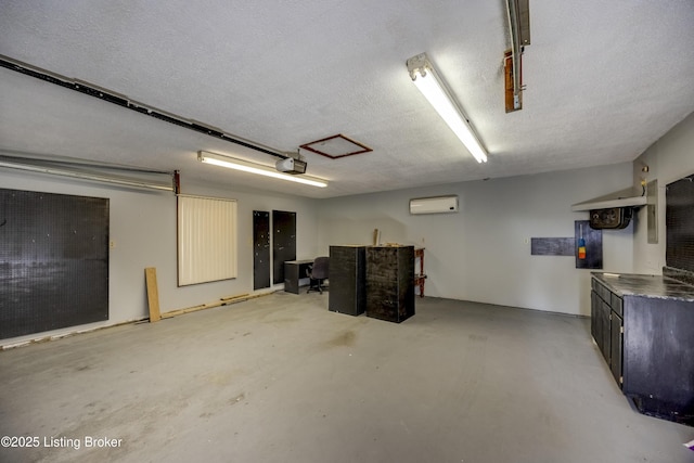 garage with an AC wall unit and a garage door opener