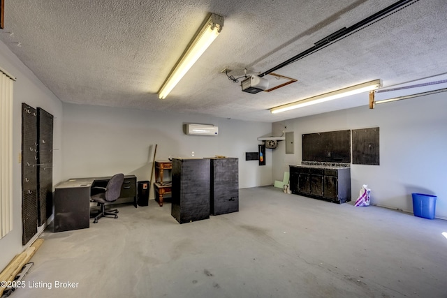 garage featuring electric panel, an AC wall unit, and a garage door opener